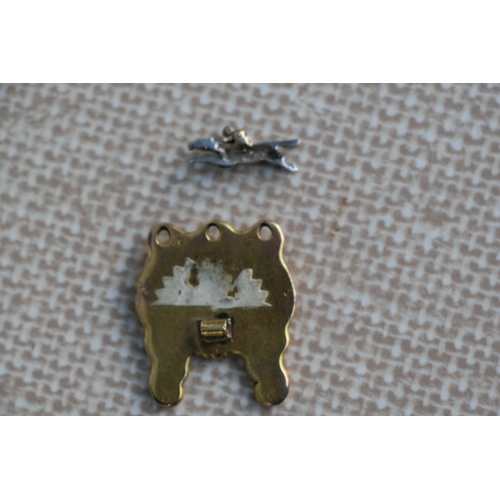 221 - Equestrian interest - A diamond pave set enamel and gold stick pin top in the form of a horse and jo... 