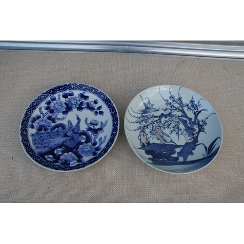 385 - A pair of Chinese blue & white plates decorated with Immortals, six character mark to the underside,... 