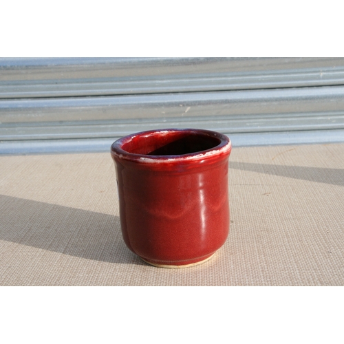 391 - A Chinese sang de boeuf brush pot bitong, 11cm (4.25 ins) high.