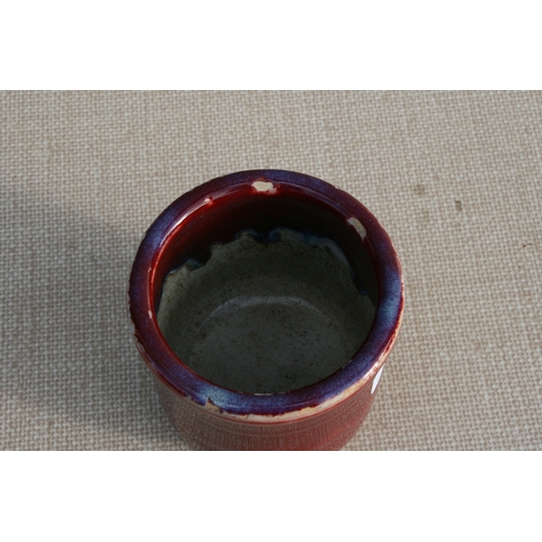 391 - A Chinese sang de boeuf brush pot bitong, 11cm (4.25 ins) high.