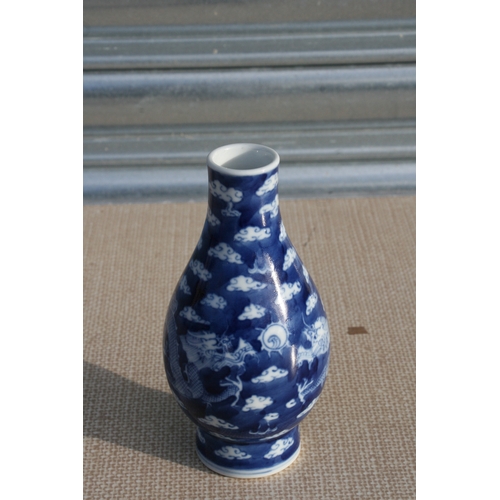 451 - A Chinese blue & white vase decorated dragons amongst clouds chasing a flaming pearl, blue six c... 