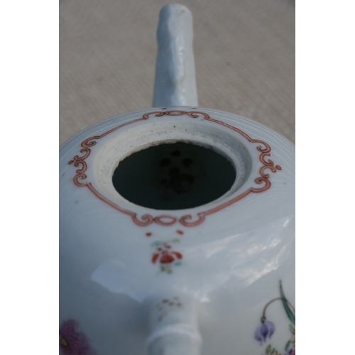 478 - An 18th century Chinese famille rose teapot decorated flowers with peach finial.9cm (3.5 ins)