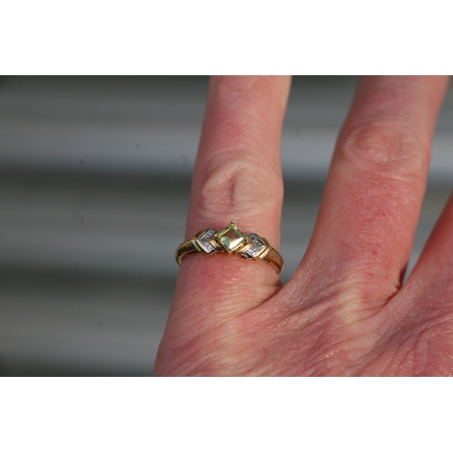 1026 - A 9ct gold peridot and diamond ring. Approx UK size N. 1.8g