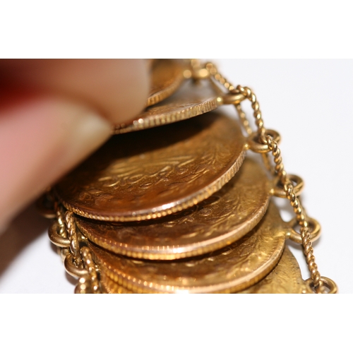 241 - A Persian or Arabic yellow coloured metal coin bracelet, the coins testing for high carat gold, weig... 