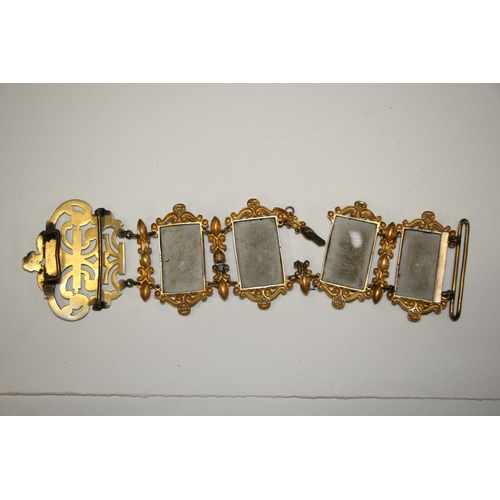 231 - A continental gilt metal and porcelain panel belt with eight rectangular panels decorated with figur... 