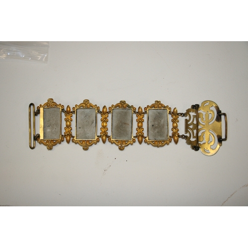 231 - A continental gilt metal and porcelain panel belt with eight rectangular panels decorated with figur... 