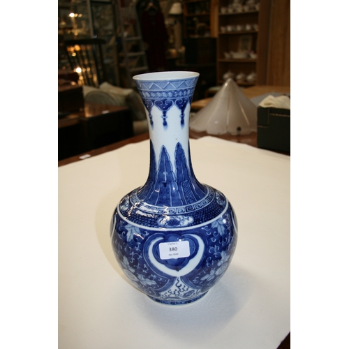 380 - A large Chinese blue & white vase decorated with flowers and dragons, four character blue mark to th... 