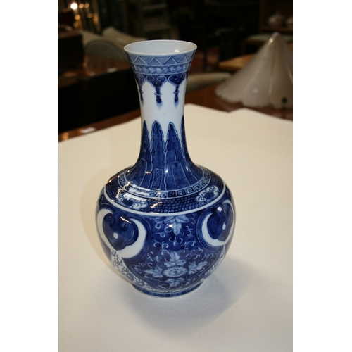 380 - A large Chinese blue & white vase decorated with flowers and dragons, four character blue mark to th... 