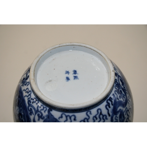 380 - A large Chinese blue & white vase decorated with flowers and dragons, four character blue mark to th... 