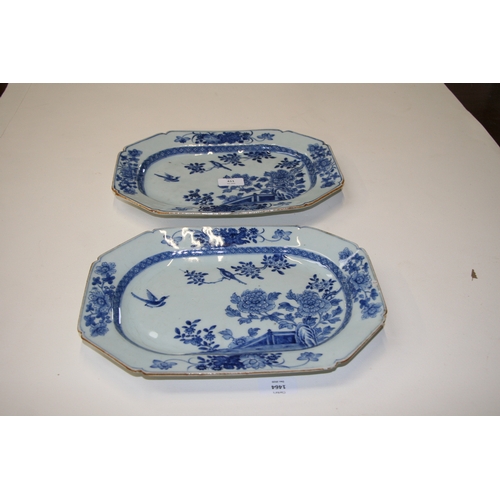 411 - A pair of 18th century Chinese blue and white dishes of elongated octagonal form, decorated birds am... 