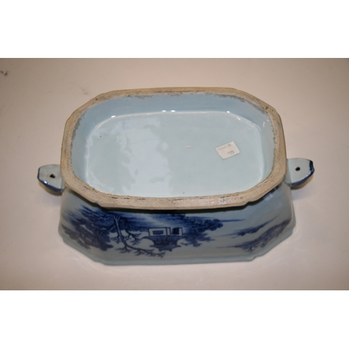 491 - An 18th century blue & white tureen and cover decorated with a landscape scene with hare's head hand... 