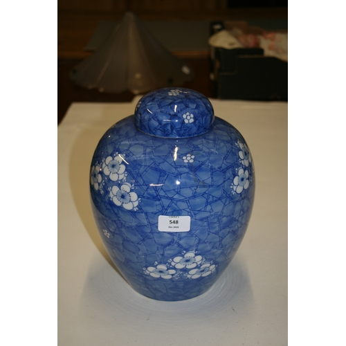 548 - A large Oriental ginger jar decorated with prunus on a cracked ice ground, 28cms (11ins) high.