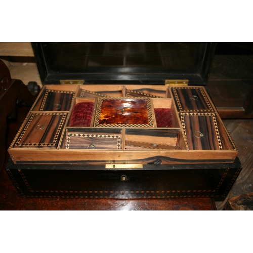 573 - A 19th century Anglo-Indian ebony workbox with fitted interior, 37cms (14.5ins) wide.