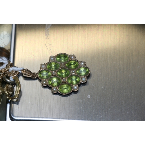 1012 - A 9ct gold peridot and seed pearl pendant; together with a 9ct gold chain; an open faced fob watch a... 