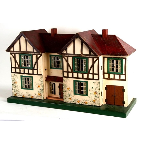 148 - A 1930's mock Tudor two storey dolls house. 85cm ( 33.55 ins) wide