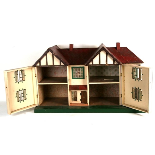 148 - A 1930's mock Tudor two storey dolls house. 85cm ( 33.55 ins) wide