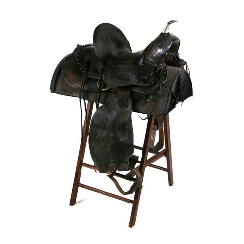 149 - An AD Seitzler & Co. Silver City, New Mexico, tooled leather Western saddle with stand