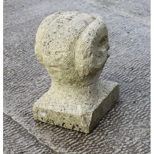 15 - A carved Portland stone bust of Bacchus, 33cms (13ins) high.