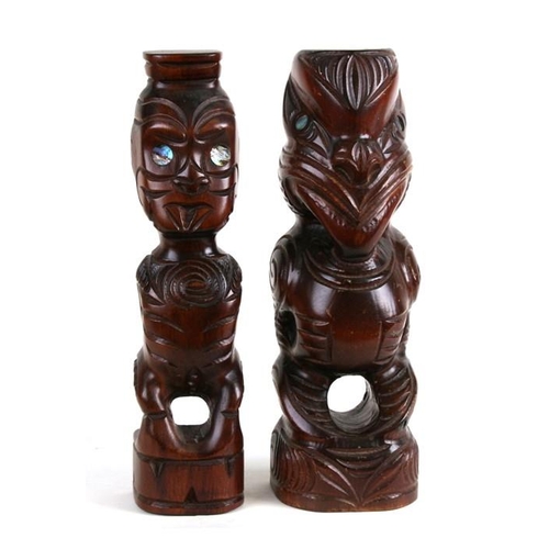 153 - Two New Zealand Mauri Tiki carved wooden figures, the largest 28cms (11ins) high (2).