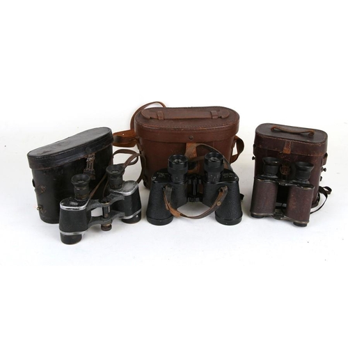 162 - A pair of Ross of London binoculars, cased; together with two similar pairs (3).