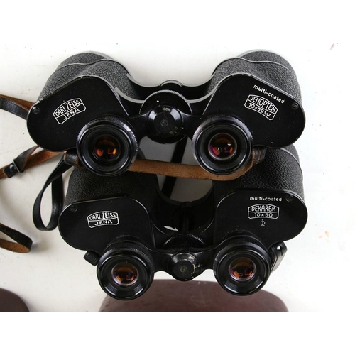 166 - A pair of Carl Zeiss Jena GDR 10x50W binoculars, cased; together with a similar pair; a Pentax camer... 