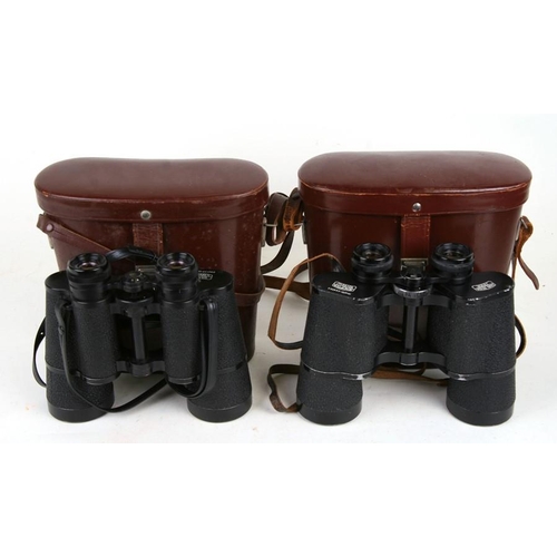 166 - A pair of Carl Zeiss Jena GDR 10x50W binoculars, cased; together with a similar pair; a Pentax camer... 