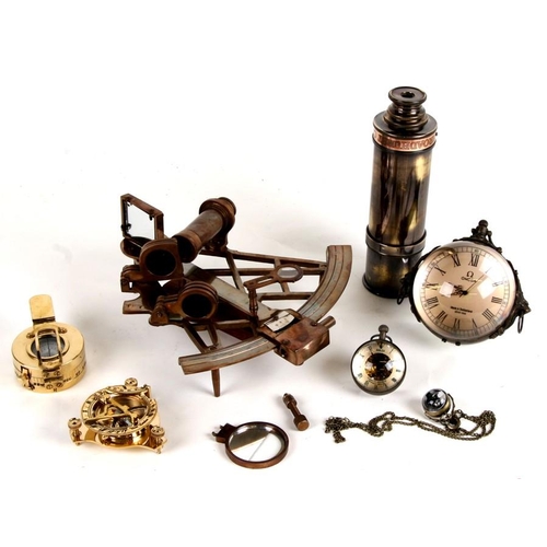 176 - A reproduction brass theodolite, two brass compasses, a telescope and other items