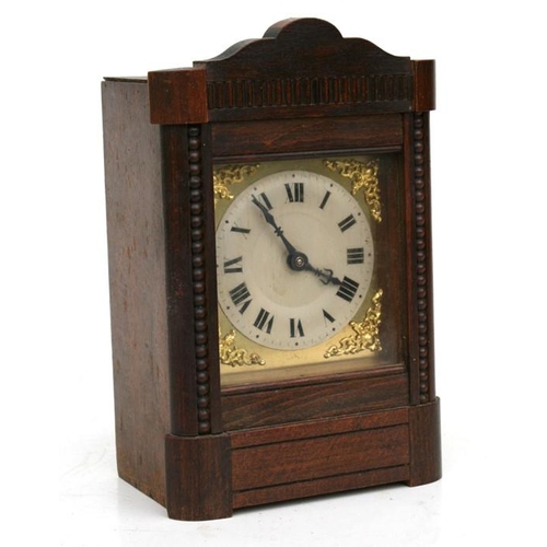 190 - An oak mantle clock, the silvered dial with Roman numerals, fitted with a movement striking on a gon... 