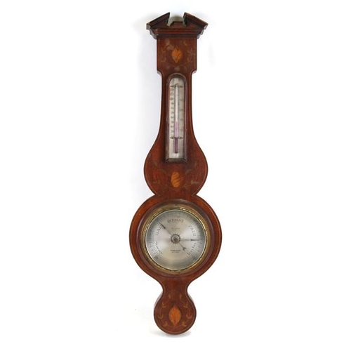 192 - An Edwardian wall barometer with thermometer in a mahogany case with shell inlaid decoration, 69cms ... 