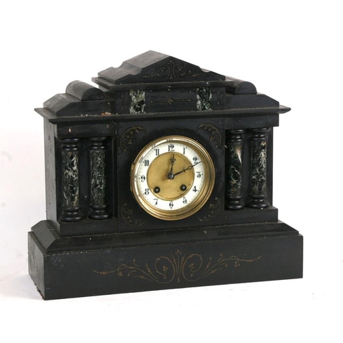 194 - A Victorian black slate mantle clock fitted with an 8-day movement striking on a gong, 38cms (15ins)... 