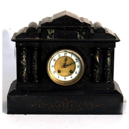 194 - A Victorian black slate mantle clock fitted with an 8-day movement striking on a gong, 38cms (15ins)... 