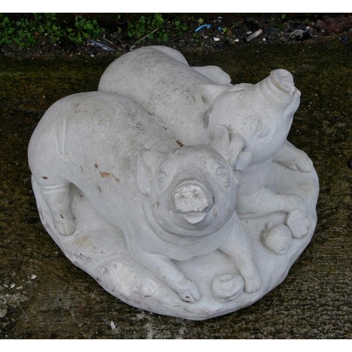 32 - A concrete group of two piglets, 33cms (13ins) wide.