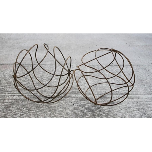 39 - A large pair of steel openwork garden spheres, 66cms (26ins) diameter.