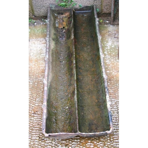 4 - A cast iron pig trough / planter, 92cms (36ins) wide.