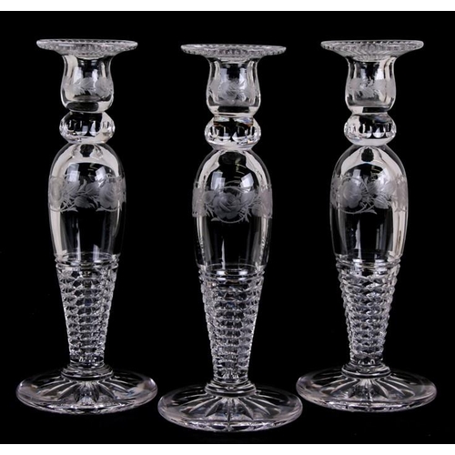 46 - A set of three Baccarat style glass baluster form candlesticks with acid etched decoration, 30cms (1... 