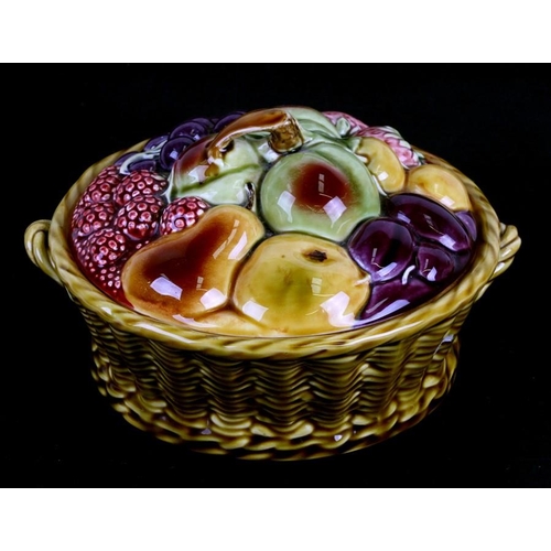 49 - A Sarreguemines majolica tureen and cover in the form of a basket of fruit, 21cms (8.25ins) diameter... 