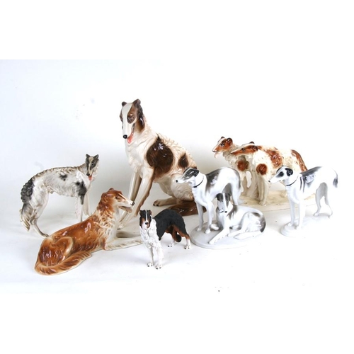 52 - A quantity of porcelain Borzoi figures and similar items, the largest 33cms (13ins) high.