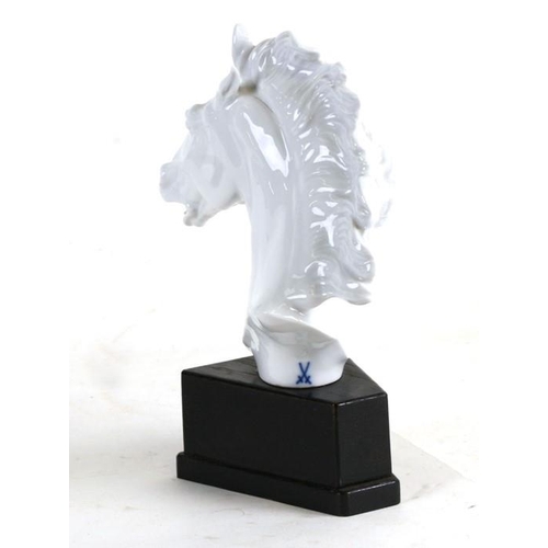 57 - A Meissen porcelain bust depicting a horse, designed by Erich Oehme, on an ebonised plinth, 22cms (8... 