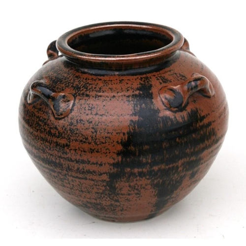 65 - A British Studio Pottery vase with four lug handles in Tenmoku glaze, impressed potters mark within ... 