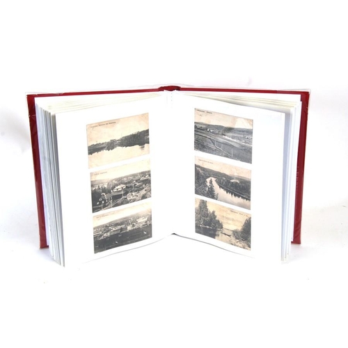 99 - An album containing early 20th century Swedish postcards of various topographical locations.