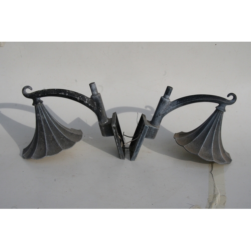 37 - A pair of patinated metal outside wall lights, 38cms (15ins) high.