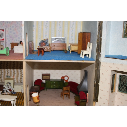 147 - A 1930's Tri-Ang mock Tudor two storey dolls house. together with some furniture and accessories 67c... 