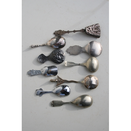 224 - A group of silver plated and white metal caddy and teaspoons to include a Dutch example.