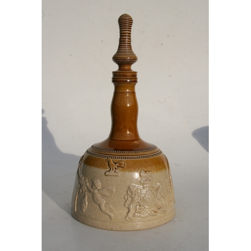 88 - A salt glazed stoneware mallet shaped decanter decorated in relief with Masonic symbols, 37cms (14.5... 