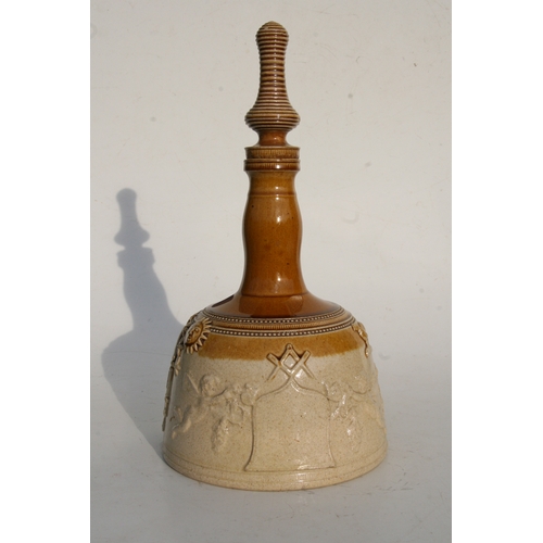 88 - A salt glazed stoneware mallet shaped decanter decorated in relief with Masonic symbols, 37cms (14.5... 