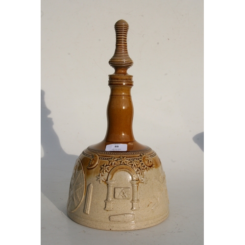 88 - A salt glazed stoneware mallet shaped decanter decorated in relief with Masonic symbols, 37cms (14.5... 