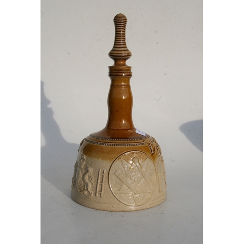 88 - A salt glazed stoneware mallet shaped decanter decorated in relief with Masonic symbols, 37cms (14.5... 