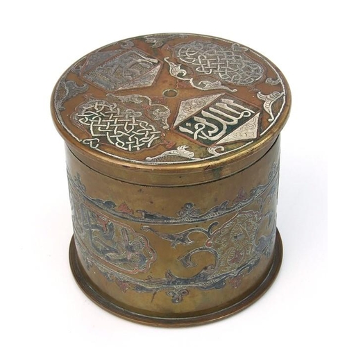 67 - A WWI trench art shell case converted to a tobacco jar with damascene decoration, 12cms diameter.
