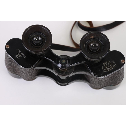 69 - A pair of WWII Toko Monarch 8x25 binoculars in a leather case.