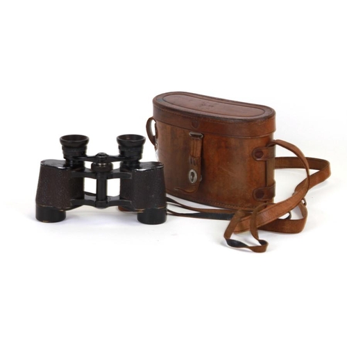 69 - A pair of WWII Toko Monarch 8x25 binoculars in a leather case.
